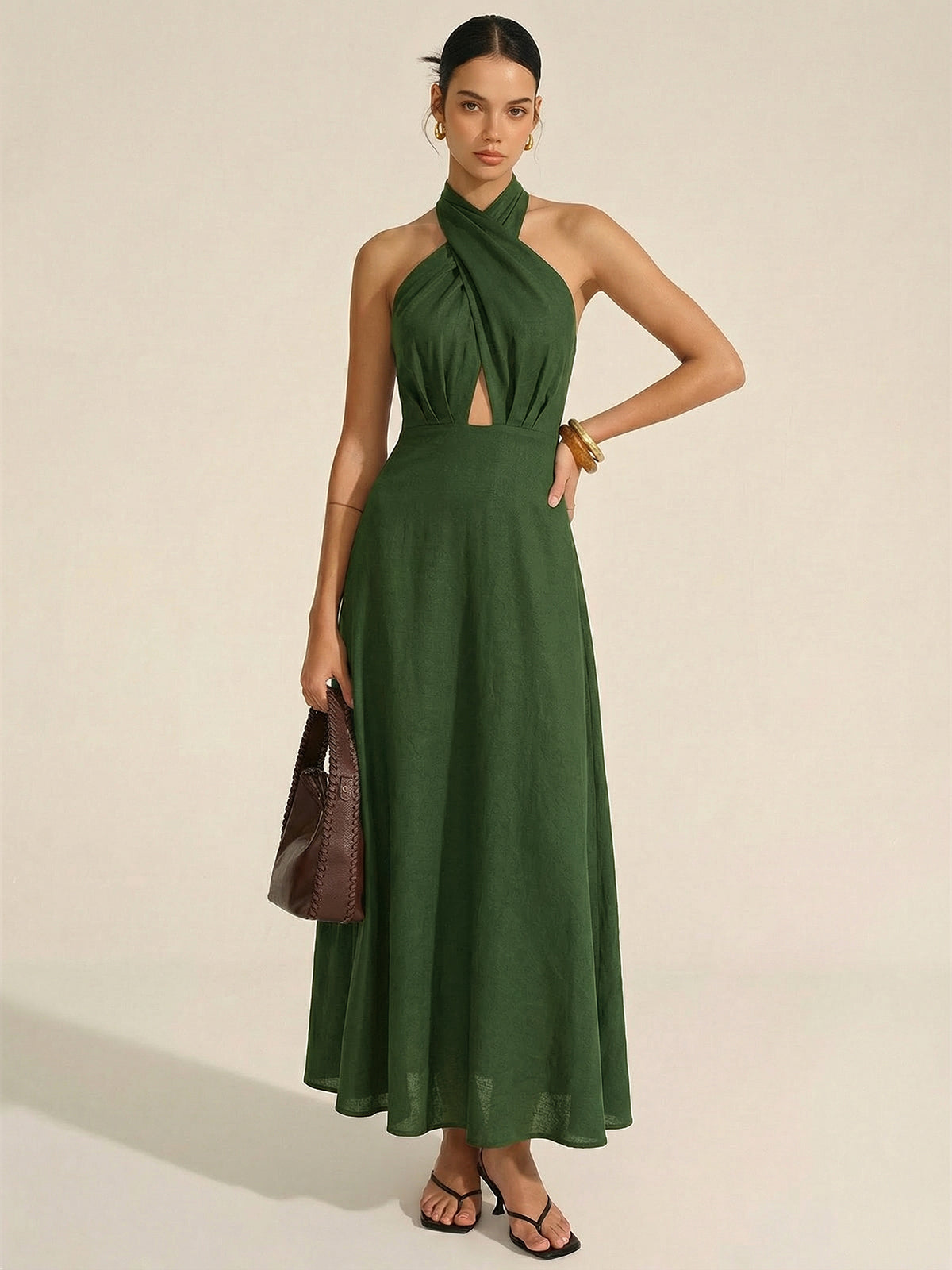 Sleeveless dark green cotton linen maxi dress with halter neck cut-out, floor-length style.