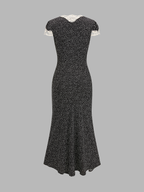 Black midi dress with lace-trimmed short sleeves, V-neckline, and small white polka dots.