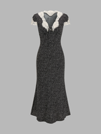 A lace-trimmed, polka dot V-neck midi dress with short sleeves and a flared skirt.