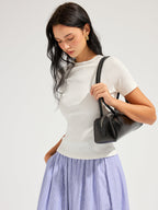 LA FINE FLEUR Open Back Ribbed Top with short sleeves and blue-and-white striped skirt.