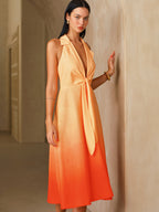 Orange ombré halter neck midi dress with deep V-neck and front tie detail.