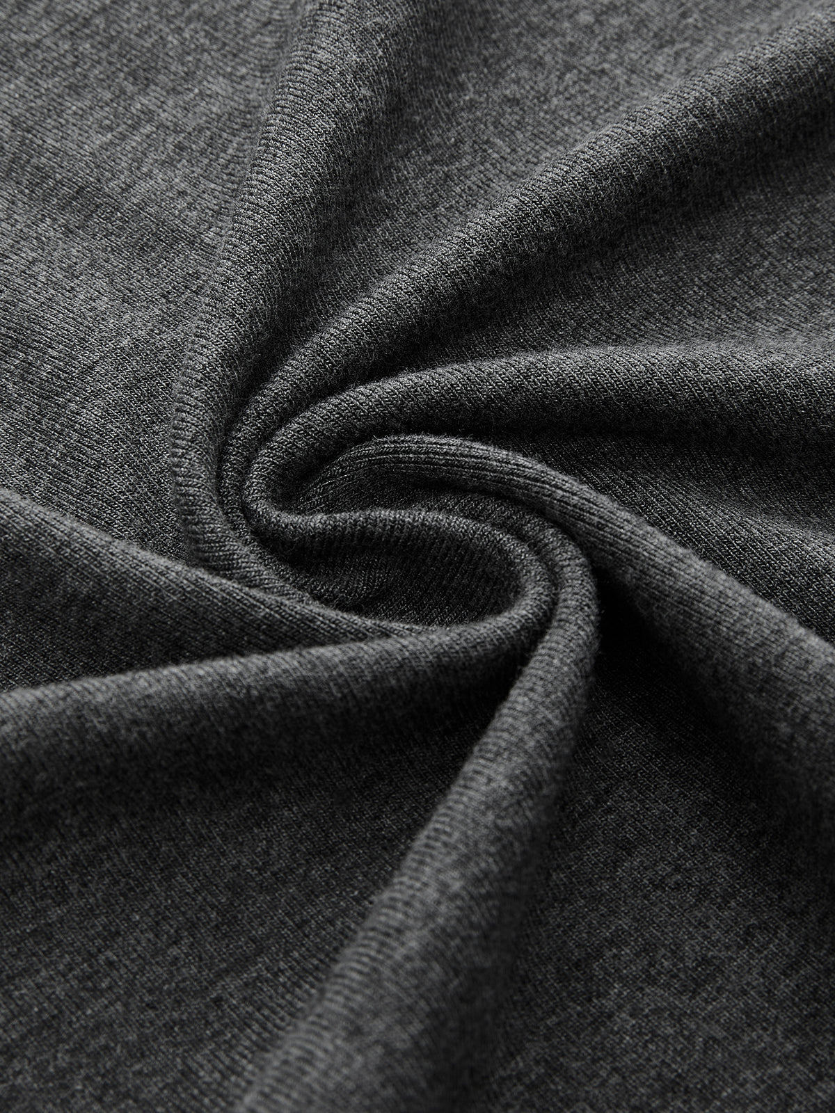 Sleeveless dark gray ruched dress with belted, asymmetrical hem and twisted, soft-textured fabric.