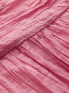 Crinkled textured fabric and diagonal seam detail on LA FINE FLEUR's halter maxi dress.