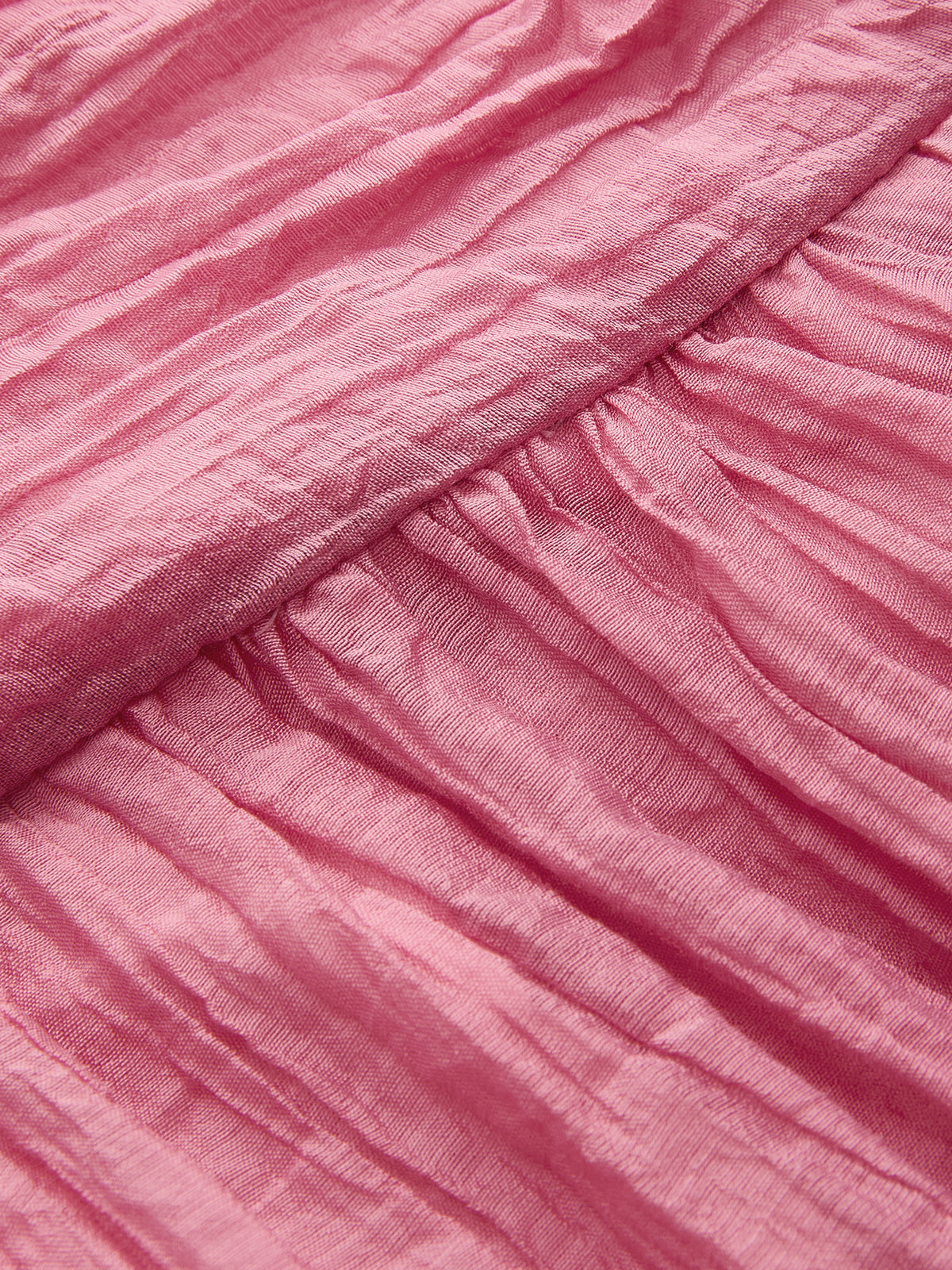 Crinkled textured fabric and diagonal seam detail on LA FINE FLEUR's halter maxi dress.