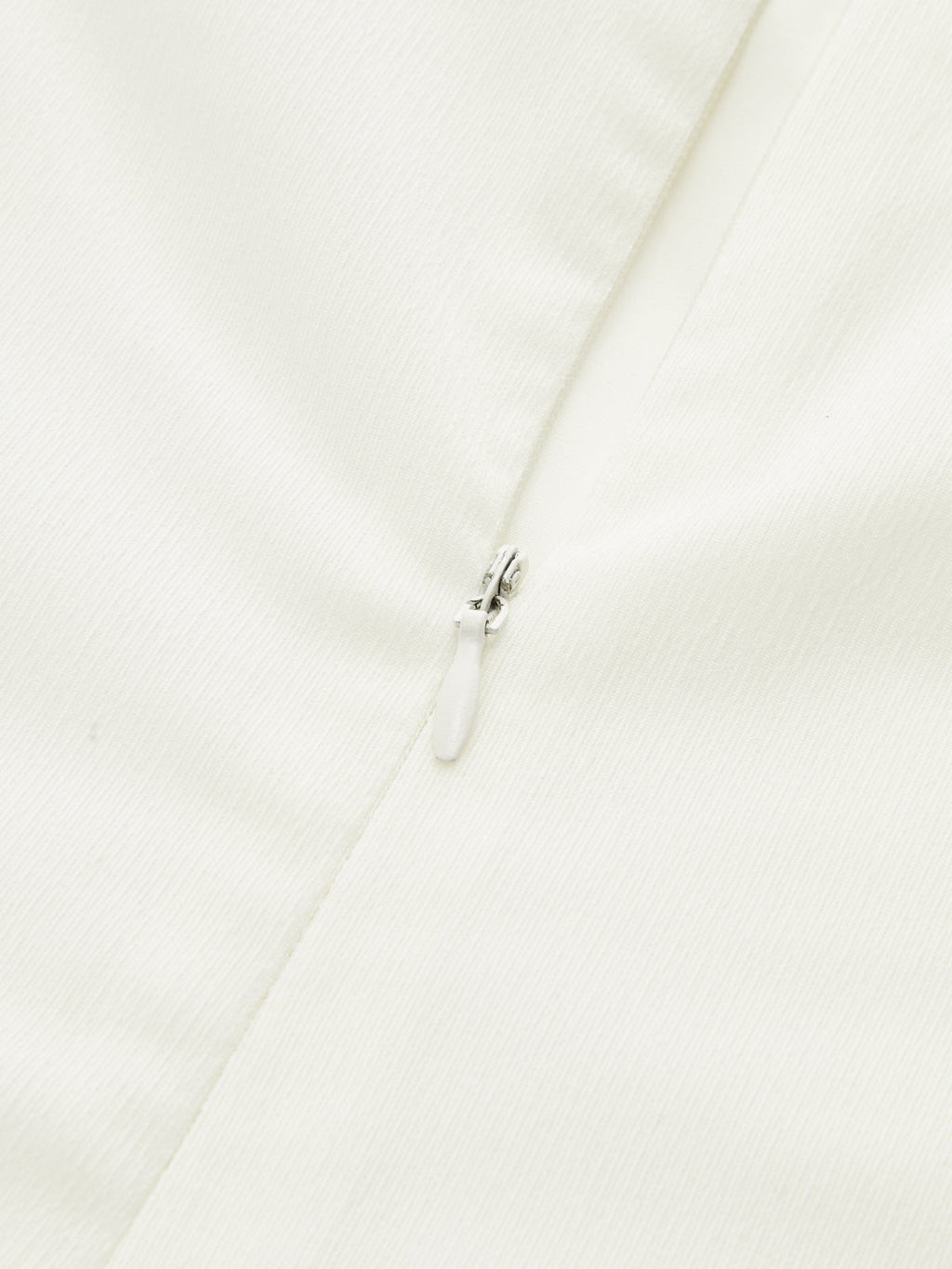 Strapless white maxi dress featuring elegant ruching and a flowy, formal silhouette.