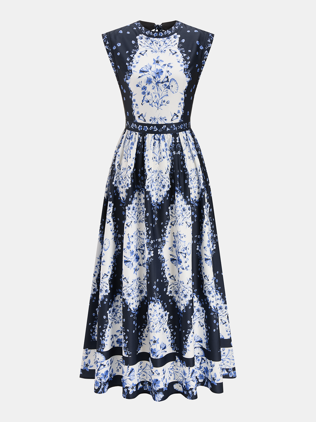 A backless white maxi dress with intricate blue floral patterns, fitted bodice, flared skirt.