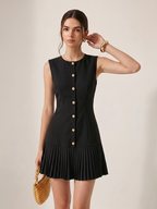 Sleeveless mini dress with metal detailing and pleats, designed for a slim silhouette.