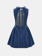 Sleeveless denim mini dress with open back, bow tie neckline, flared skirt, zipper.