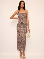 A flowy, sleeveless maxi dress with a camisole top in an elegant style.