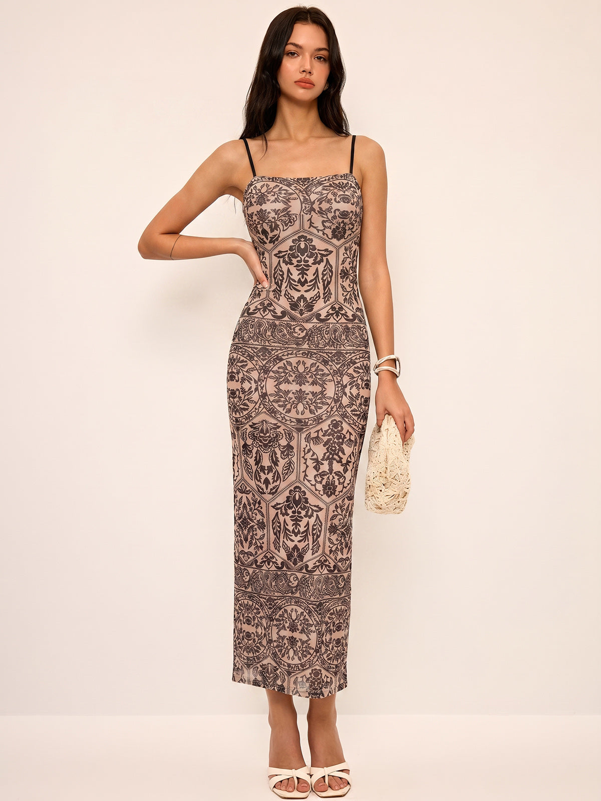 A flowy, sleeveless maxi dress with a camisole top in an elegant style.