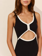 Sleeveless LA FINE FLEUR maxi dress with white contrast trim and cut-out detailing.