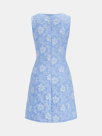 Slim fit sleeveless jacquard mini dress with white floral pattern and subtle A-line shape.