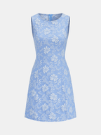 Sleeveless jacquard mini dress with fitted bodice, flared skirt, and white floral design.