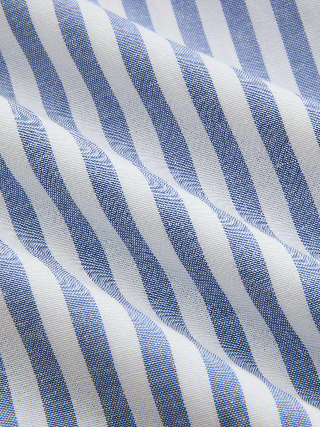 Striped halter midi dress with cotton collar, wavy blue and white stripes, soft textured fabric.