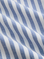 Striped halter midi dress with cotton collar, wavy blue and white stripes, soft textured fabric.