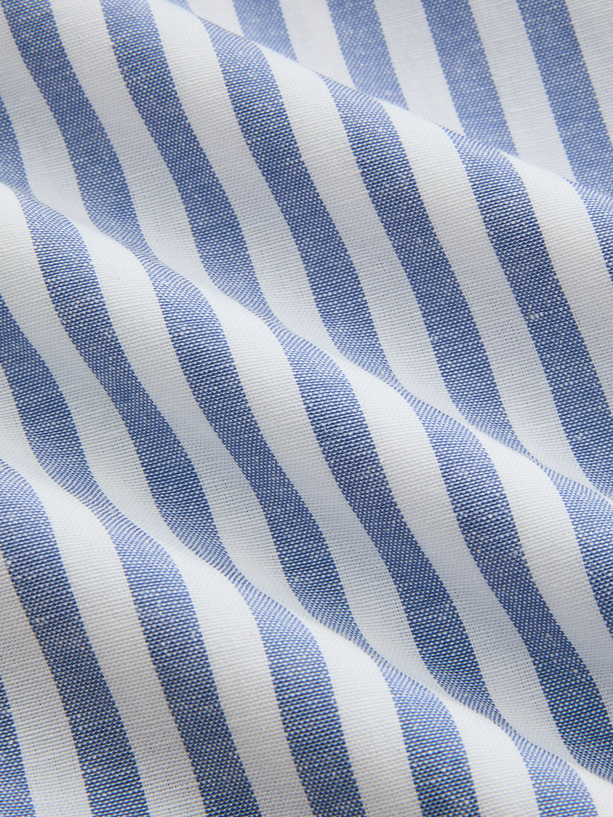 Striped halter midi dress with cotton collar, wavy blue and white stripes, soft textured fabric.