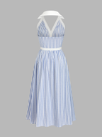 Blue and white striped halter midi dress with deep V-neck, waistband, and flared skirt.