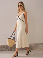 LA FINE FLEUR sleeveless maxi dress with contrast wavy trim, V-neck, adjustable straps.
