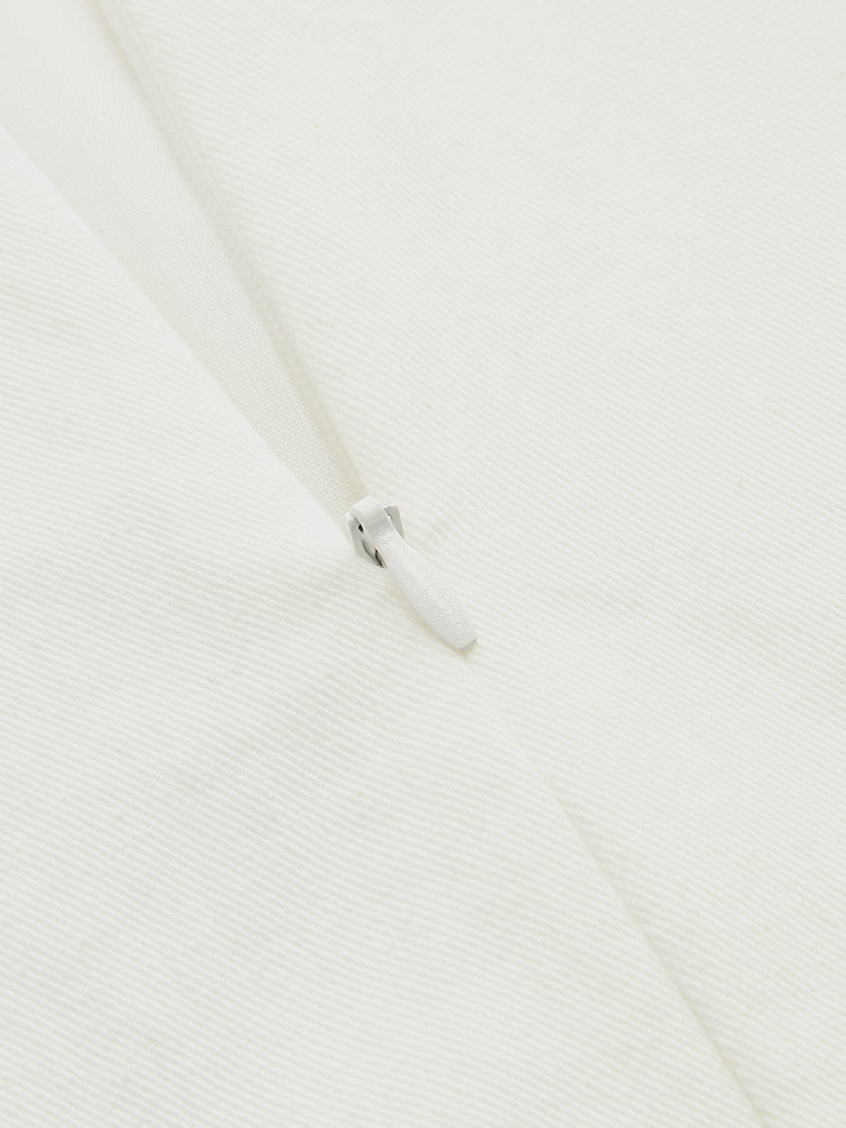 Close-up of LA FINE FLEUR Contrast Stitch Midi Dress with buttoned cami and white zipper.
