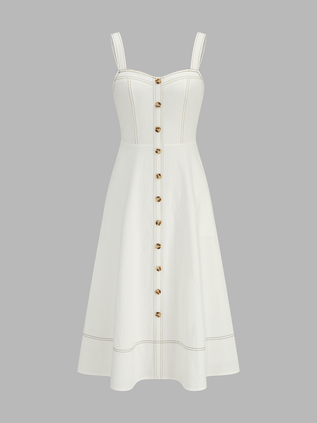 A midi dress with a square neckline, thick straps, gold buttons, and contrast tan stitching.