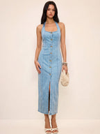 LA FINE FLEUR denim halter dress featuring a button-front design in a maxi length.
