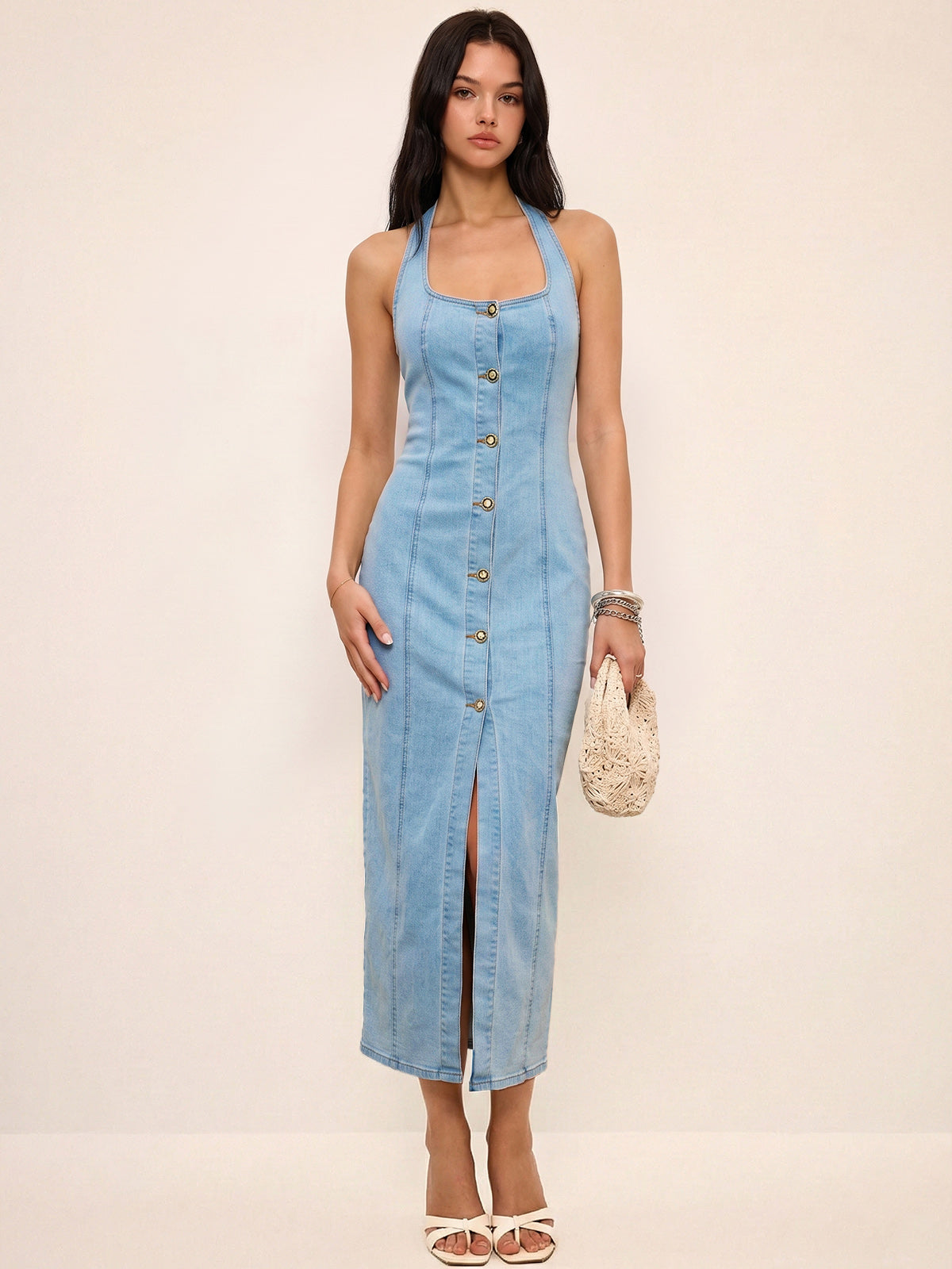 LA FINE FLEUR denim halter dress featuring a button-front design in a maxi length.