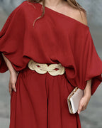 Skew neck lantern sleeve blouse with wide leg pants, featuring off-shoulder elegance.
