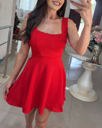 A square-neck, thick-strap textured romper with tie-back skorts in a chic design.